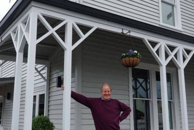 Michael Barker outside the renovated Vicarage Geraldine luxury hotel accommodation