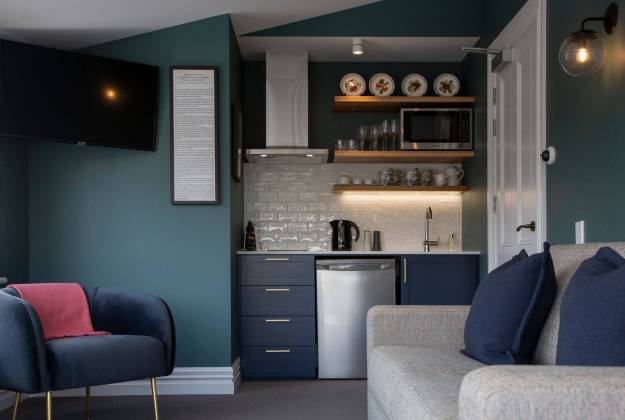 Upstairs sitting room with kitchenette at The Vicarage Geraldine luxury hotel accommodation